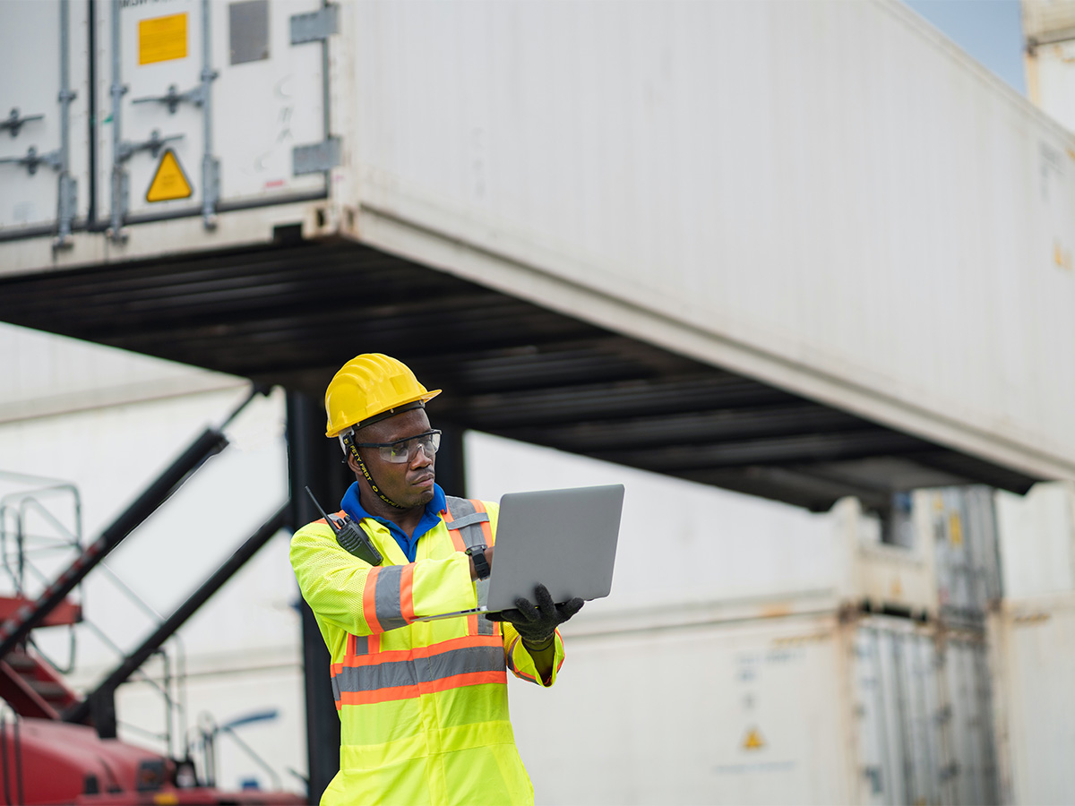 employee-inspecting-containers-chrome-cargo